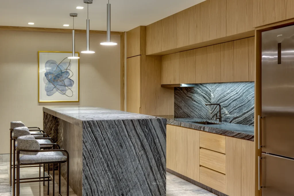 Modern kitchen with an island in the OCEAN FRONT SWIM UP MASTER CORNER SUITE, offering a stylish and functional space for dining and entertaining.