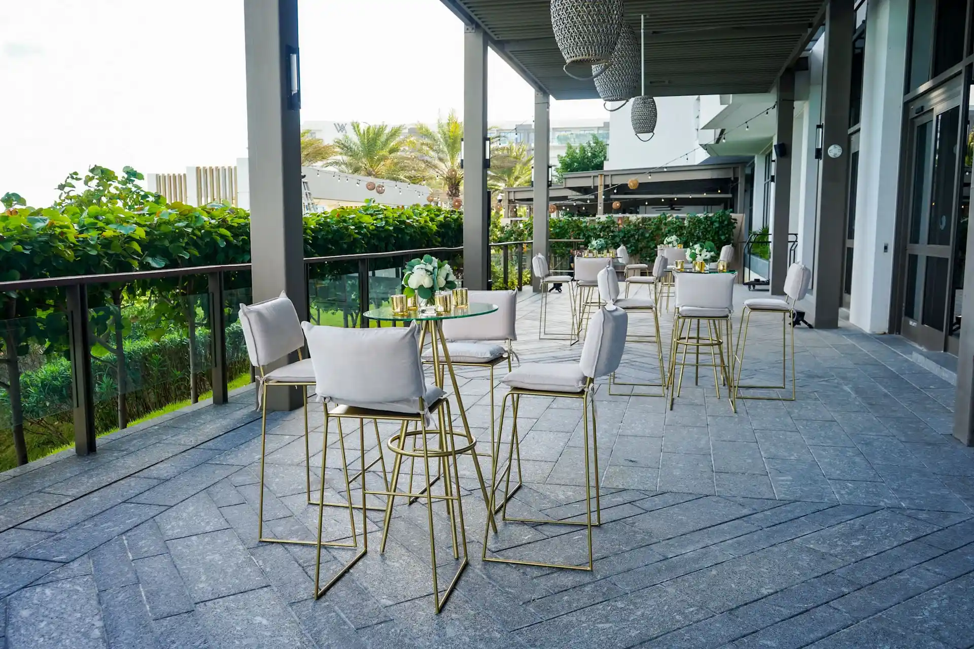 Sunny terrace with outdoor seating and scenic views.