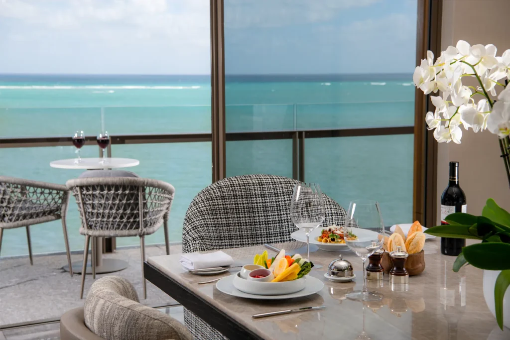 Luxury in-room dining with ocean view at Waldorf Astoria Cancun – Exquisite gourmet experience served in the comfort of your suite
