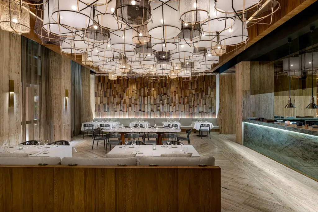 Refined interior of Malpeque at Waldorf Astoria Cancun, featuring elegant design and a sophisticated dining atmosphere