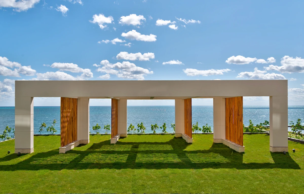 Elegant wedding pavilion surrounded by lush greenery, perfect for outdoor ceremonies.