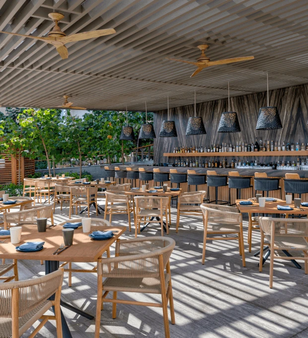 The terrace of the pool bar, offering a stylish and inviting atmosphere with stunning views and a relaxing vibe.