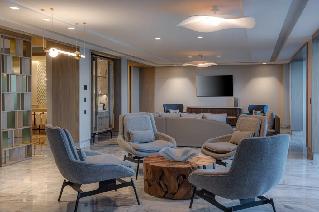 Spacious living area of the OCEANFRONT 2 BEDROOM PRESIDENTIAL SUITE, designed with stylish furnishings and offering a comfortable, luxurious ambiance