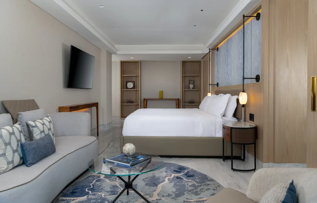 Luxurious bedroom interior of the OCEANFRONT 2 BEDROOM PRESIDENTIAL SUITE, featuring elegant décor, plush bedding, and a tranquil, inviting atmosphere