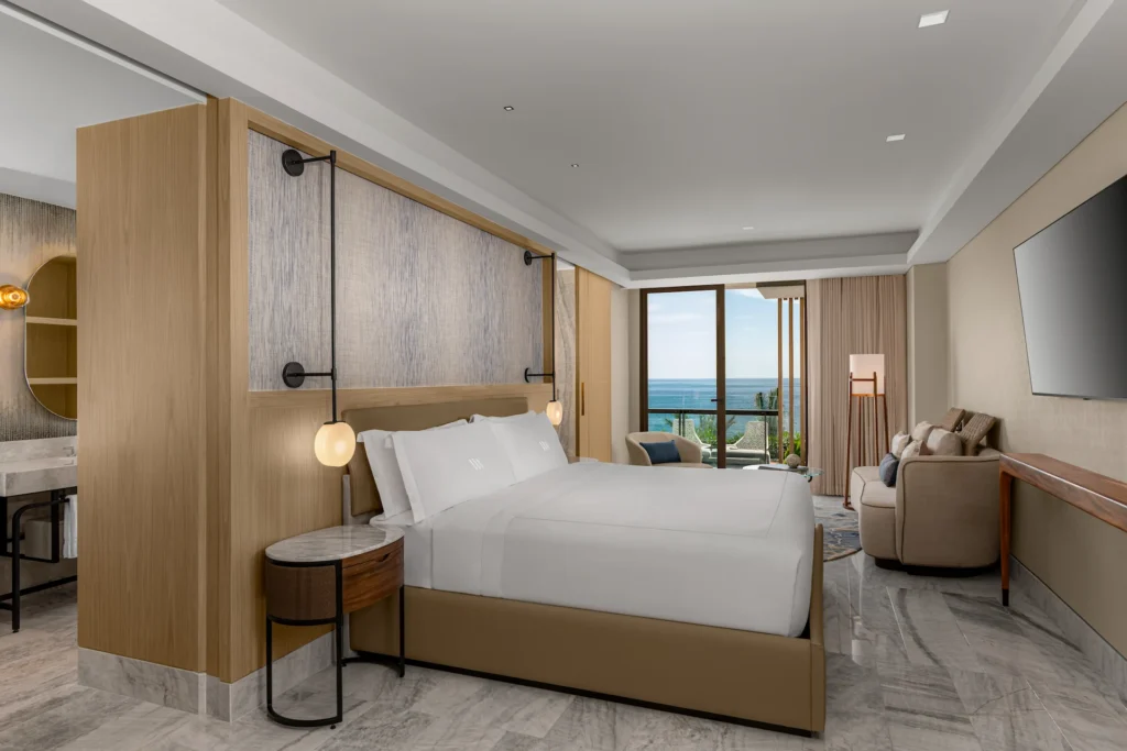 Interior of the OCEANFRONT 2 BEDROOM PRESIDENTIAL SUITE bedroom, featuring sophisticated décor, a king-sized bed, and a serene, luxurious ambiance