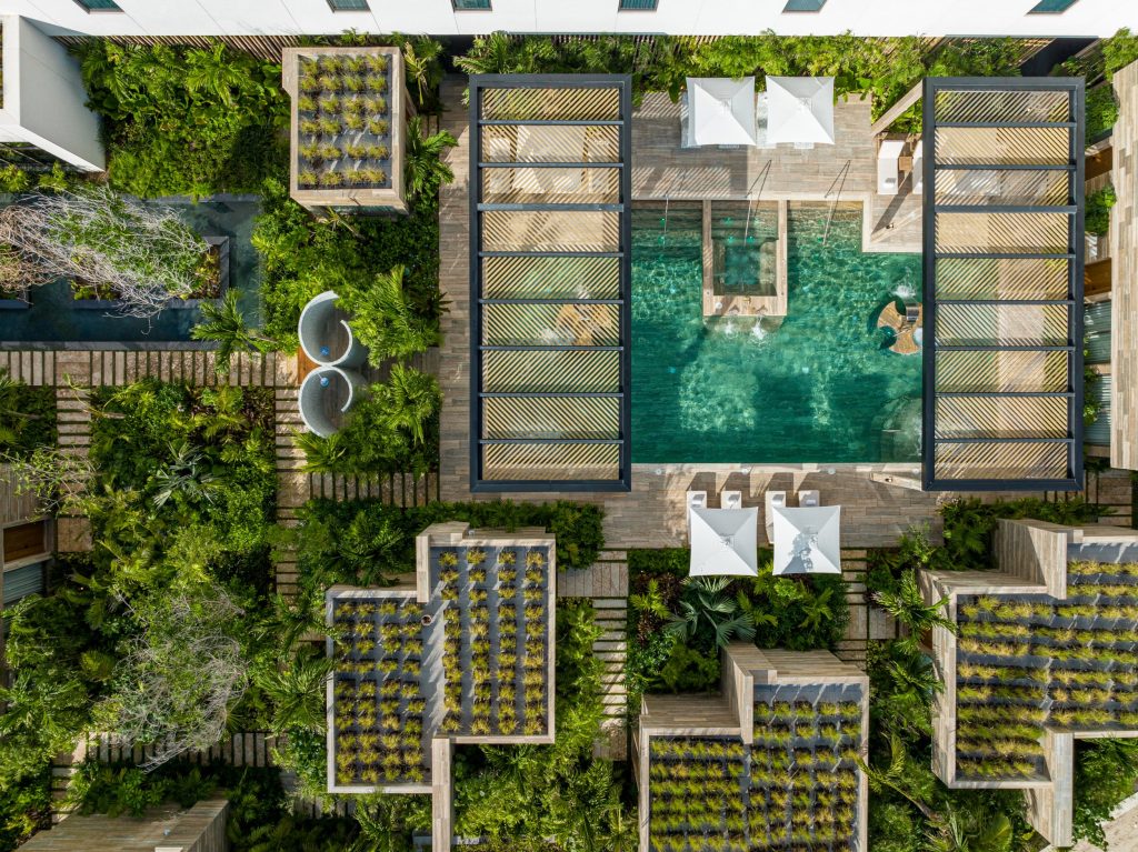 An overhead view of the spa, completely surrounded by lush vegetation, creating a peaceful and natural retreat.