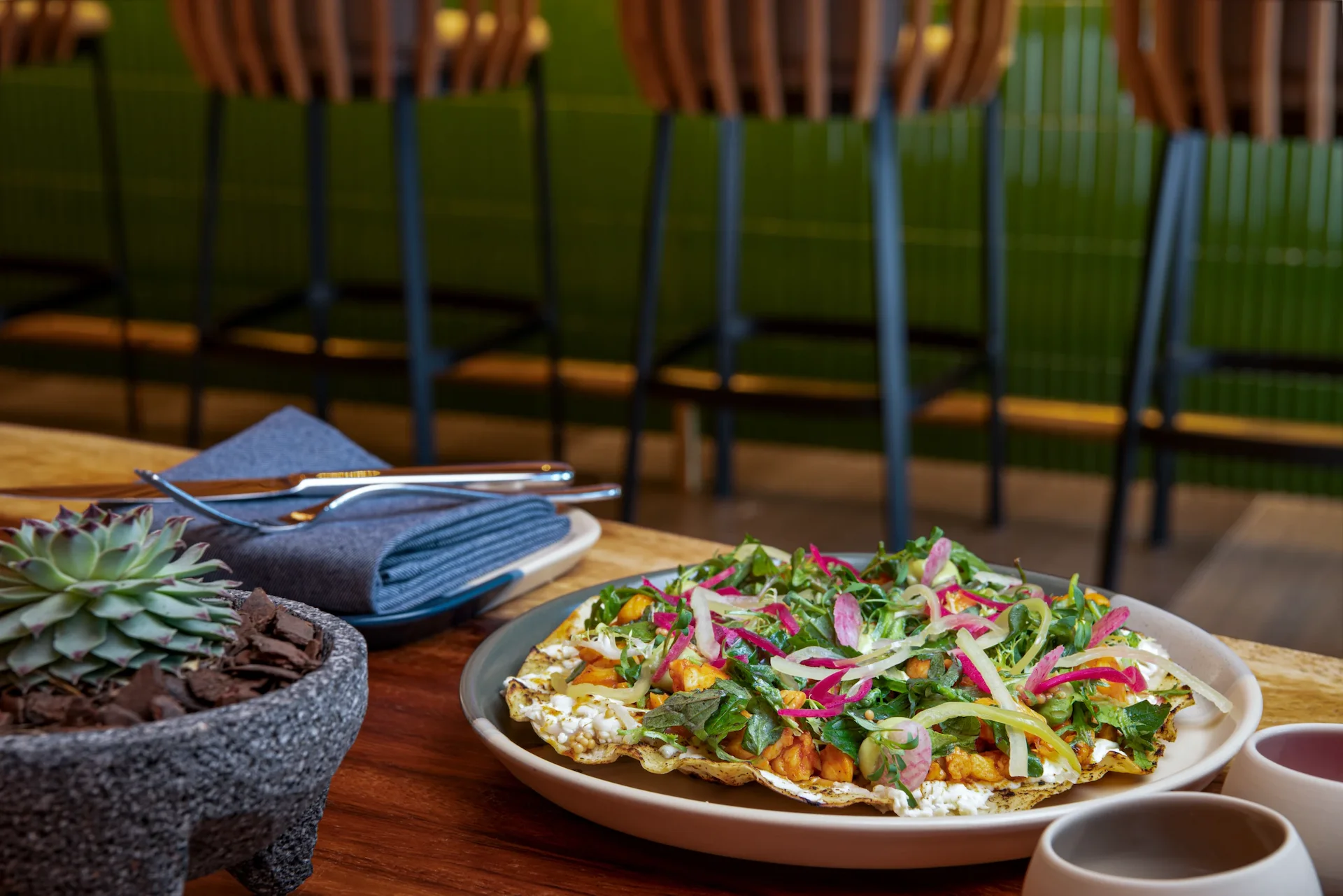 A delicious, vibrant salad served over a crispy tortilla—fresh, healthy, and absolutely irresistible.