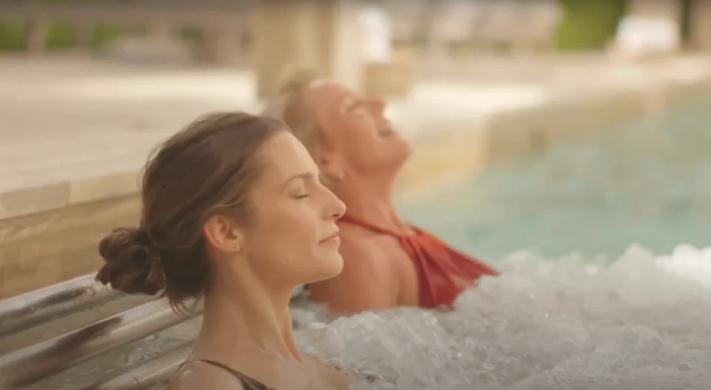 Women relaxing and enjoying the soothing, bubbling spa at Waldorf Astoria spa